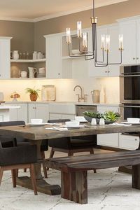 We love the lighting in this kitchen, especially our Rainey chandelier. Rainey’s larger scale makes a bold focal point in great rooms, dining rooms and open-plan layouts.