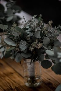 This bride opted for a dark, earthy green bouquet with eucalyptus as the main plant used. Photo taken by Vanessa Lewis Photography