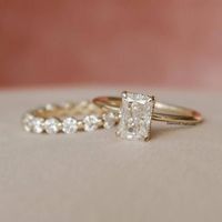 7x5 MM (1.00 Ct) Radiant Cut Moissanite Diamond Hidden Halo Ring, Matching Full Eternity Band, Bridal Wedding Ring Set, Solid Gold Ring Set Detail about stones Moissanite & Simulated Stone: ----------------------------- ➠Stone Shape : Radiant ➠Stone Size : 7x5 MM ➠Weight: 1.00 CT ➠Color: Colorless ➠Cut: Excellent ➠Clarity: VVS ✍This Listing's images are only for Imagin about this item. This is all our photography. If you place the order then the same item we can make it. ✍ This displayed all pro