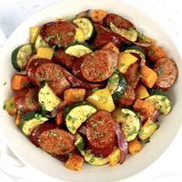 Sheet Pan Sausage and Veggies Smoky kielbasa and a savory medley of juicy roasted veggies tossed with spices and herbs makes this Sheet Pan Sausage and Veggies the ideal answer for a busy weeknight dinner. #ketosheetpan #sheetpandinner #lowcarbsheetpan