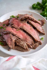 Instant Pot Flank Steak is both tender and delicious. Proof that bold flavor doesn’t have to cost a fortune or take hours to cook!