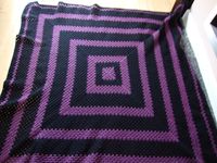 Purple and black granny square blanket. X