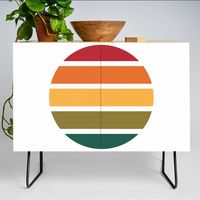 A true statement maker. Our versatile mid-century modern inspired credenzas are great for use as TV stands, armoires, bars, office cabinets or the perfect complement to your bedroom set. The vibrant art printed on the doors will make your piece pop in any setting. Available in a warm, natural birch or a premium walnut finish.