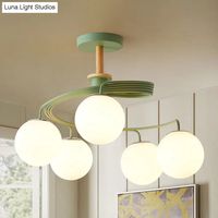 This stylish and modern Swirl Flush Chandelier is a great addition to any room. It features a Nordic iron construction with five bulbs, green and grey swirl patterned orb glass shade, and a wooden downrod. With a range of sizes from 20 to 24 inches and a fixture width of 23.5 inches and fixture height of 18 inches, this ceiling light is sure to fit any room perfectly. This product does not include any bulbs, so you will have to provide your own. However, the bulbs should easily fit in the E26/E2