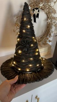 Watch me turn this $7 witch hat into something a little more magical  Witch hat  • Witch hat (linked in LTK)  • Black twine or jute  • Twinkle lights