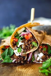 Fast and flavorful, Turkish Lamb Wraps are made with savory ground lamb seasoned with flavorful Turkish spices, wrapped up in a tortilla with labneh, cucumbers, tomatoes, mint, parsley and peppery watercress. A simple weeknight dinner that can be made in under 30 minutes. #lamb #americanlamb #lambwrap #turkishwrap