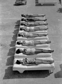 Fashion models relaxing near a pool in Miami, Florida Jan 1, 1956.  [::SemAp FB :: || :: SemAp G+::]