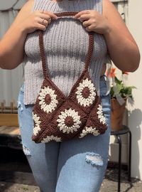 crochet granny square purse 👜  Made with 100% cotton  Bag is unlined  Has a magnet button to close  Message me with any questions! 🥰