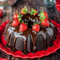 This easy chocolate bundt cake is super moist and fudgy. Topped with a shiny chocolate glaze, it's a chocolate lovers dream come true. The best thing about bundt cakes is that you only need one bowl to make them and no special decorating skills. Nothing beats a homemade chocolate bundt cake from scratch. #chocolate #bundt #cake #dessert #easy #moist #scratch #glaze #valentinesday #birthdaycake #cakedecorating #recipe