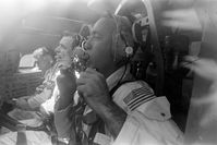 The prime crew of the Apollo 9 space mission are seen inside an Apollo command module boilerplate during water egress training activity in the Gulf of Mexico. From foreground, are astronauts Jim McDivitt, commander; Dave Scott, command module pilot; and Rusty Schweickart, lunar module pilot.