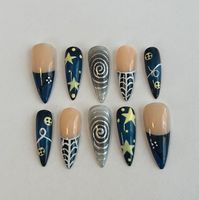 Coraline-inspired custom press-on nails. All nails are reusable and custom-made to fit the buyer's nails. All nails are made with hard gel for extra support and sturdiness. Each order comes with an application kit, which includes nail glue, a nail file, a cuticle pusher, a nail buffer, an alcohol wipe, and a free sticker.