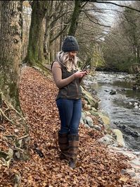 Forest Green Tweed Gilet This gilet features exquisite herringbone tweed paneling that adds a touch of sophistication and elegance. The herringbone tweed collar complements the overall design, enhancing the timeless appeal of this garment. Designed for both style and functionality.