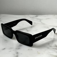 Brand New Prada Pra07s Sunglasses In Black. Featuring A Black Rectangular Acetate Frame With Dark Grey Lenses. Silver Metal Plaque Prada Logos On Temples. Measures 52-20-145. 100% Authentic And Unworn. Made In Italy. Box, Case, Cloth And Paperwork Included. Retail Price $531.