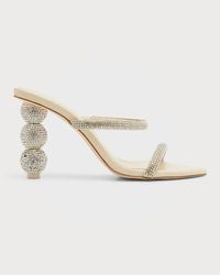 Finding the perfect shoes for your wedding day is an important task; let this list of the best designer wedding shoes narrow down the choice and help you out. For example, these Cult Gaia heels are just gorgeous!