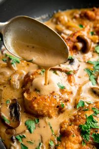 Juicy pan-fried chicken in a rich marsala wine sauce with mushrooms and a splash of cream. I like to lightly coat the chicken in a seasoned flour mixture that adds even more flavour to this impressive dish. I'll also show you what to do if you want a no-alcohol version. #chickenmarsala #chickeninsauce #chickencreamysauce