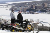 Snowmobiliers in Hancock, MI looking at Michigan Tech.