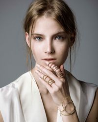 I love the style of the shorter of the two rings. Nikos Koulis chain rings in gold, with matching bracelet.