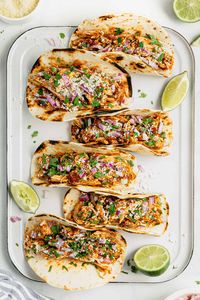 Healthy Slow Cooker Chicken Tacos | Midwest Foodie | With just 5 minutes of prep time, these 5 ingredient slow cooker chicken tacos are healthy, tasty and almost too easy to make! Toss everything in the crock pot, come back a few hours later, shred the chicken and you're ready to sit down for dinner!