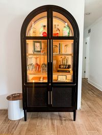 When I saw this cabinet at Sam’s Club, I knew I had to have it!   We had a bar cart, but this was going to truly elevate the space!   So with a little convincing, I got my husband to agree! I mean the price was great for this sturdy piece of furniture!   We got it home, added some lighting and wine glass holders as I wanted to make this a bar cabinet to replace our bar cart… and eeeeee! I love it!!!!   What do you think? Doesn’t it look like an elevated piece! You’d think I spent a lot more on it!   #affiliate #samsclub #memberdmark #furniture #interiordesign #interiordecor  #bar #cabinet #decor