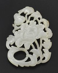 JADE 'PEONY' PLAQUE QING DYNASTY, 18TH CENTURY 2 3/8 in.