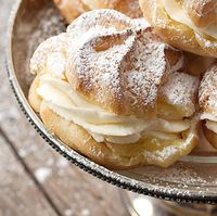 Delicious Cannoli Cream Puffs take the classic cream puff in a new direction with a cannoli filling, made with ricotta and mascarpone cheese.