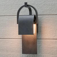 A panel of aluminum is bent forward at the top and cradled by a bracket. A beautiful textured Rustic Forged finish is used in keeping with the pastoral design elements. Cleverly concealed inside the arch is a LED light source which sheds ample light to the surface below without forward glare.