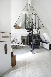 Loft in Paris kitchen and dining room in black and white.