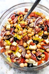 This simple chickpea salad is loaded with big Italian flavor from hot soppressata, provolone, black olives, pepperoncini peppers, and more.