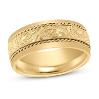 Distinctive floral patterns line the center and are flanked by delicate milgrain detail in this stunning wedding band, fashioned in lustrous 14K yellow gold.