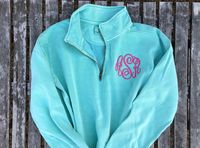 Comfort Colors Monogrammed Quarter Zip Sweatshirt. These are unisex style pullovers. Model is shown wearing a chambray size small. Main example photo is a chalky mint pullover with a master circle monogram in #21 tropical pink thread.  ►Instructions for Ordering:  In the personalization box please include the following information 1. Thread Color 2. Monogram initials in the order you want them embroidered. Typical monogram order is first initial, last name initial, middle initial. Example Jane H