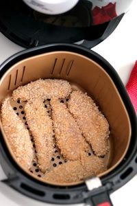 The fry basket filled with breaded Ranch Chicken Tenders getting ready for the Power Air Fryer XL.