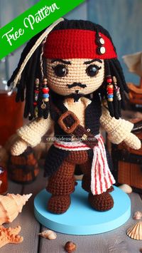 Set sail on a crochet odyssey with a charming Amigurumi that channels the adventurous spirit of the sea’s most whimsical pirate. This pattern captures the essence of the beloved, roguish captain with his iconic tricorn hat, flowing dreadlocks adorned with beads, and the classic pirate attire, complete with a sash and boots.