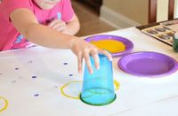 Circle Art Process Painting.  Open-ended creative activity for toddlers, preschoolers, kindergarteners, or elementary children, perfect for exploring shapes and colors.