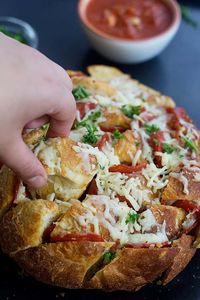 Pepperoni Pull Apart Bread is full of cheese and amazing flavors. Have your favorite pizza in a form of a pizza pull apart bread with no hassle in no time!