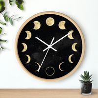 Moon Wall Clock Diameter: 10 inch / 25 cm .: Wooden frame .: Plexiglass face .: Pre-installed backside hook .: For indoor use .: Requires one AA battery (NOT included) .:  Silent clock mechanism