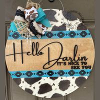 Hello Darlin, I mean you can't hear that without hearing Conway's iconic voice say that. Our beautiful western inspired Hello Darlin is perfect for those cow print lovers and a touch of sass. Hand painted with 3D lettering and a beautiful bow just completes this classic look. Give your door some decor with a western flair. Colors can be customized as well, please note if you would like any changes and we will do our best to accommodate. We do offer fully custom signs as well, feel free to messag