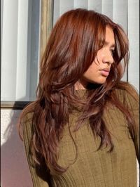 Copper, brown, copper brown haie, face framw layers, layers, voluminous hair, green shirt