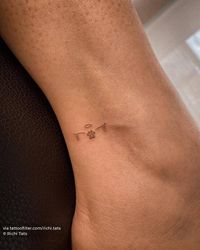 Minimalistic pet memorial tattoo located on the ankle.