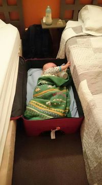 soooo smart. Instead of using a portable baby bed just reuse the suitcase. Less stuff to bring on the trip.