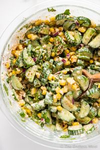 This simple cucumber salad is inspired by our favorite street food, Mexican street corn. With crunchy cucumbers, sweet corn, cojita cheese, and a creamy dressing, it's an easy side dish with a bit of kick to complement any Mexican-style meal. Buen provecho! #theendlessmeal #mexicancucumbersalad #cucumbersalad #salad #cucumber #mexican #mexicansalad #sidedish #mexicanside #cucumbercornsalad #elotesalad #elotes #cornsalad