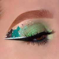 This colorful eye looks is amazing. It's looks pretty and cute.This eye drawing is very unique. If you are looking for more eye makeup ideas,you can visit our website.