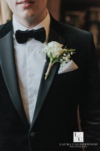 Black tie groom with gypsophila and white rose buttonhole | Photo by Laura Calderwood Photography | Carlton Towers Wedding Yorkshire