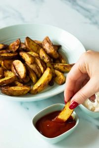 15 minutes is all you need to make the best air fryer potato wedges. Lightly seasoned with salt & olive oil they're baked to perfection in the easiest way possible - and a great healthier alternative.