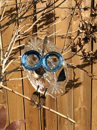 little blue glass owl, sits on a copper pole. made from vintage glass and cutlery