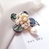 ECO-FRIENDLY MATERIAL: The brooch is made of freshwater pearls, black mother of pearls - the abalone shell, and high-quality alloy. It is cadmium-free, and nickel-free; No allergenic reaction. They are comfortable to wear. The exquisite design never goes out of style. The brooch will create a beautiful festive atmosphere.