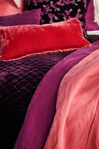 Taline 24x24 Pillows in Poppy and Fig, Lynette 24x24 Pillow in Fig, Ines Lumbar Pillow in Fig, Carmen Kidney Pillow in Fig. Silk Velvet Quilted Coverlet in Fig and Taline Personal Comforters in Fig and Poppy.