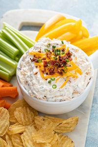 A good chip dip is a must for any game-day spread. This Loaded Baked Potato Dip is filled with all of the ingredients that go on top of a baked potato and is delicious with potato chips or even waffle fries!