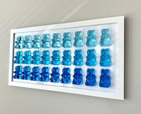 Colors gradient of blue Handmade out of resin Enclosed in resin for stronger structure. Gummy Bear: Large (3x2 inches) There are 2 frame variations:  - White Frame  - Black Frame Can make personalized versions upon request. If we have one in hand, we can ship in 1 - 2 business days.