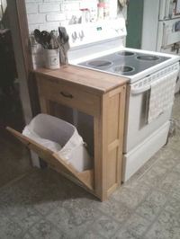 #27. Make a garbage can cabinet and cutting board countertop for your small kitchen! | 29 Sneaky Tips For Small Space Living