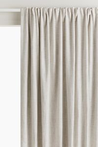 Wide, extra-long blackout curtain panels in woven fabric with lining to prevent light from shining through. Multiway header for four different hanging options: on a curtain rail with curtain loops, with drapery hooks, with four-prong drapery hooks, or a modern wave style. Hooks not included. Hemmed. Dark colors generally block out light more effectively than light colors.